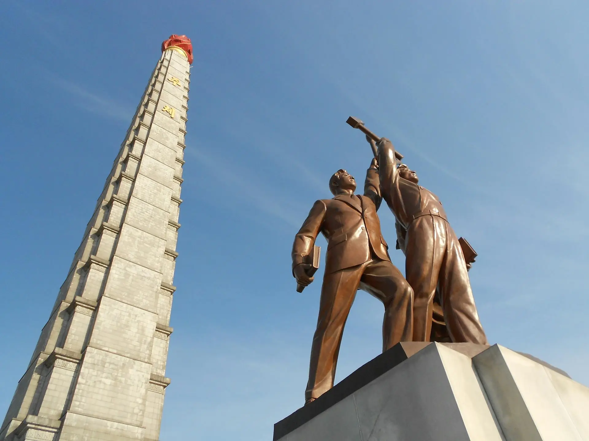 Juche-Tower-and-Statue-in-Pyongyang-in-North-Korea.webp